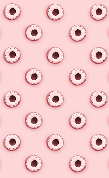 Muchos pequeños donuts de plástico se encuentra en un fondo de colores pastel