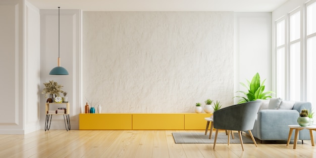 Foto mueble para tv en la pared de yeso blanco en salón con sillón y sofá, diseño minimalista.