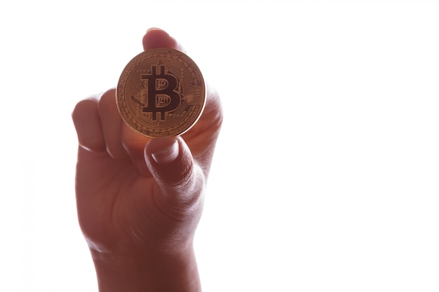 Münze Bitcoin BTC in der Hand