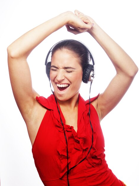 Foto mujer bailando música con auriculares