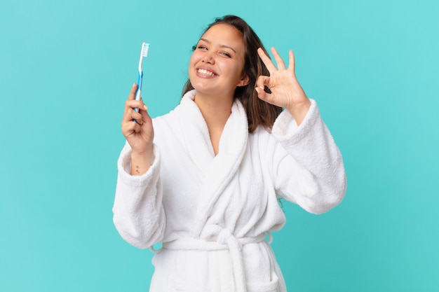 Foto mujer bonita joven vistiendo albornoz