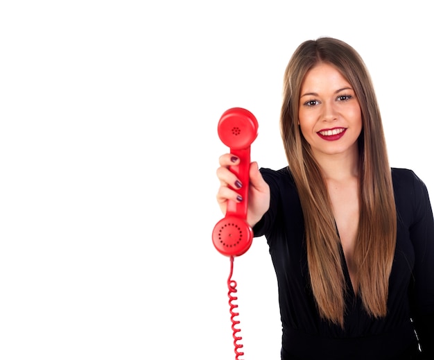 Foto mujer con estilo con un teléfono rojo