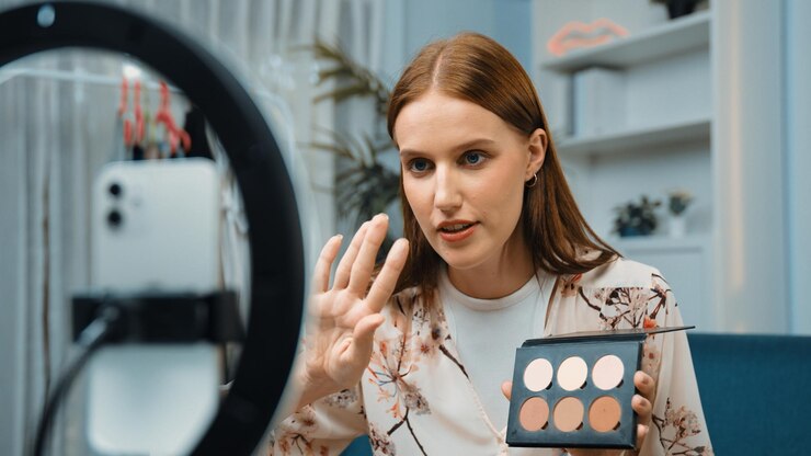 Foto mujer influyente disparar transmisión en vivo vlog video revisión maquillaje prim social