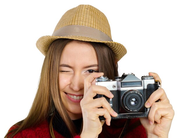 Mujer joven alegre con cámara