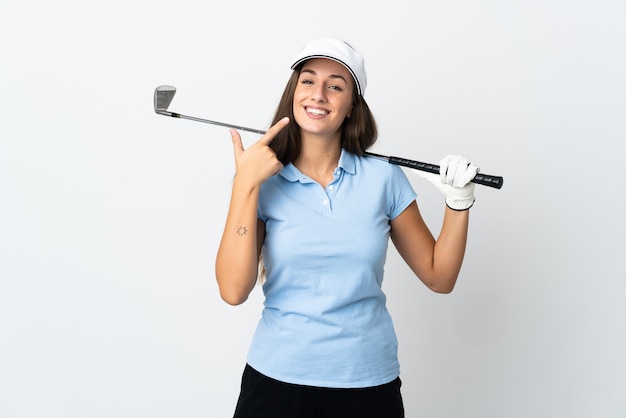 Mujer joven golfista sobre pared blanca aislada dando un pulgar hacia arriba gesto