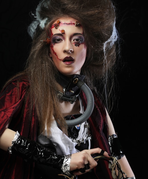Foto mujer joven con maquillaje creativo. tema de halloween. tema zombi.