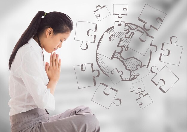 Mujer de negocios meditando contra escaleras grises borrosas con garabato de rompecabezas