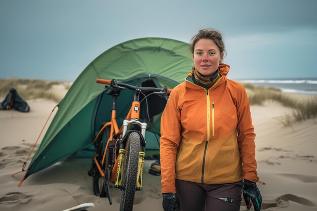 Una mujer de pie frente a una carpa en una playa Imagen generativa de IA