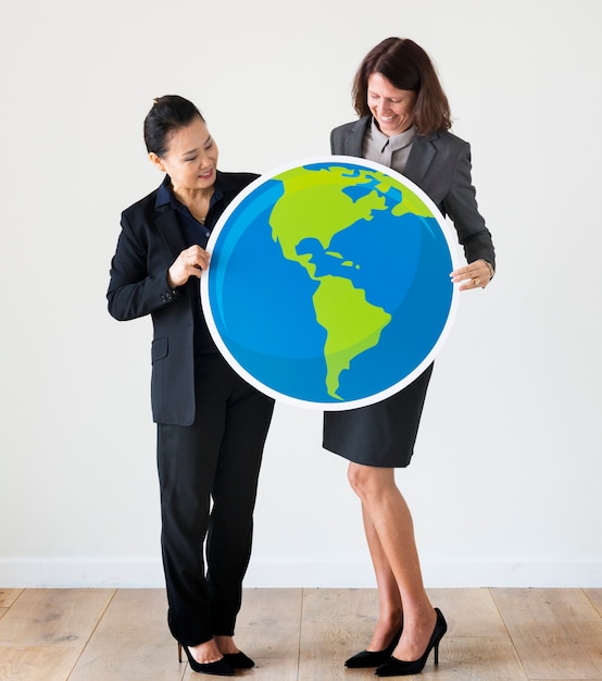 Foto mujeres empresarias con icono de globo