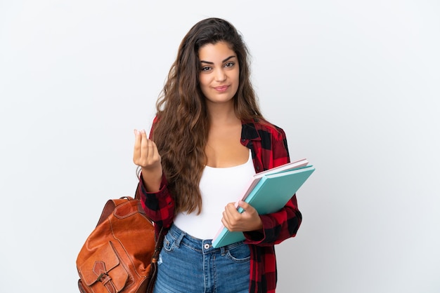 Foto mulher jovem estudante isolada no fundo branco fazendo gesto de dinheiro