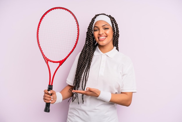 Mulher negra afro com tranças. conceito de tênis