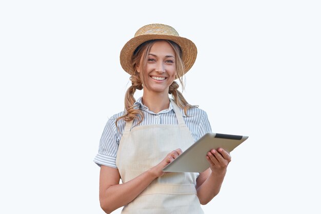 Mulher vestida de avental com fundo branco tablet digital mulher caucasiana de meia-idade, empresária uniformizada