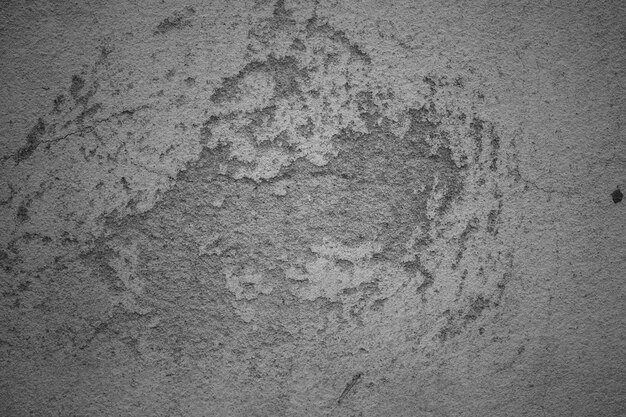 Muro de cemento negro con fondo de hormigón