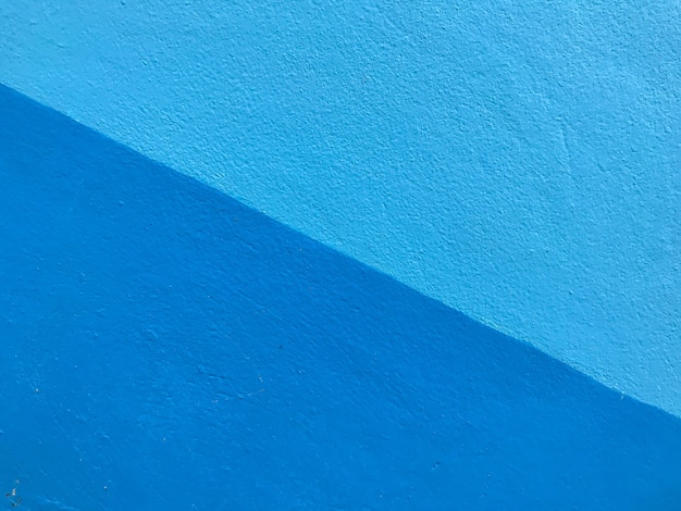 Foto muro de cemento el pastel pintado de azul tiene detalles.