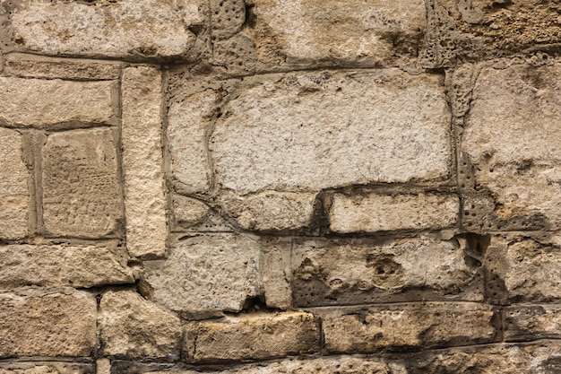 Muro de alvenaria antiga. Parede de um antigo castelo na cidade velha. Boa textura de pedra