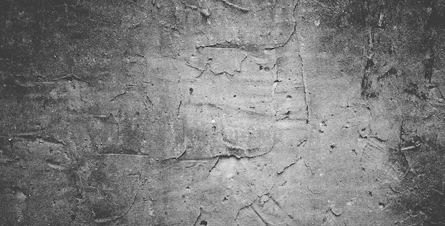 Foto muro de concreto preto ou fundo de textura de pedra granulada áspera cinza escuro