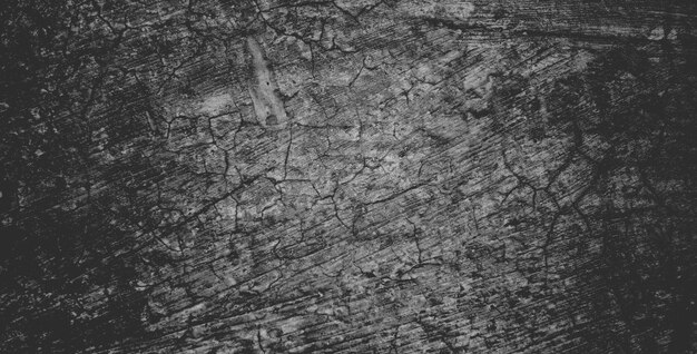 Muro de concreto preto ou fundo de textura de pedra granulada áspera cinza escuro