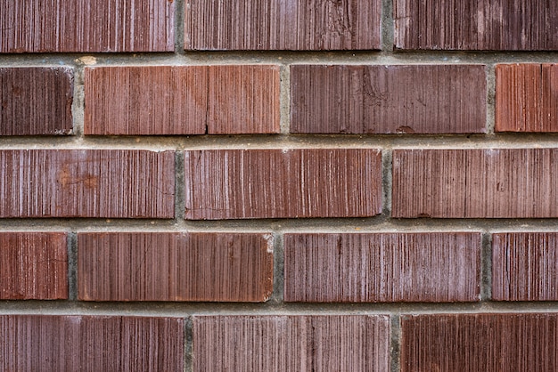 Foto muro de edificio nuevo hecho con ladrillos rojos cerrar vista