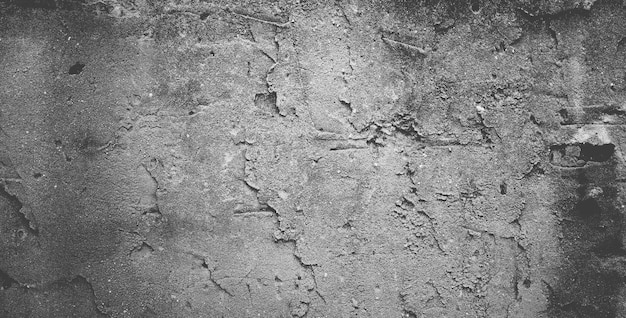 Muro de hormigón negro o fondo de textura de piedra granulada áspera gris oscuro