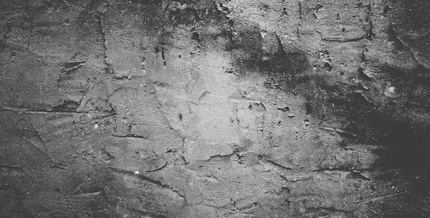 Muro de hormigón negro o fondo de textura de piedra granulada áspera gris oscuro