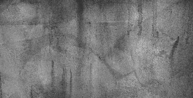 Muro de hormigón negro o fondo de textura de piedra granulada áspera gris oscuro