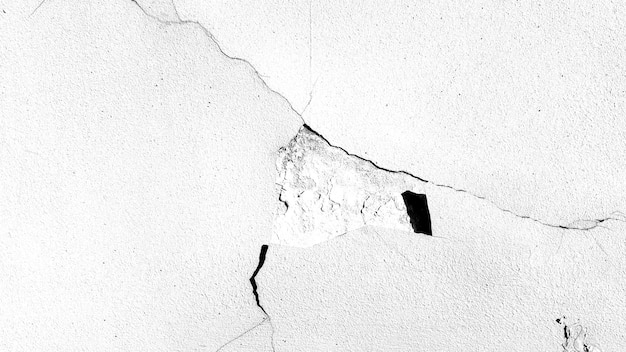 Muro de piedra con una grieta. textura en blanco y negro para el diseño