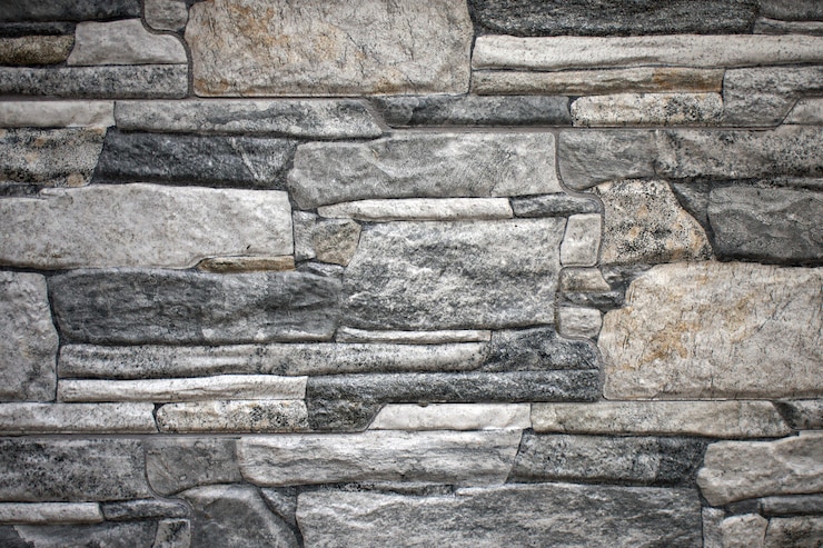 Foto muro de piedras rocosas irregulares en una casa