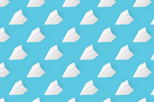 Muster von weißen Papierflugzeugen auf einem blauen Hintergrund.