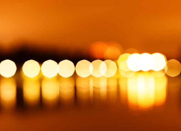 Foto nachtlichter der stadt bokeh mit reflexionshintergrund hd