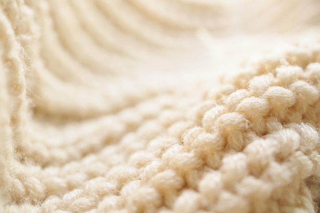 Nahaufnahme beige gestrickter Wollstoff Textur Hintergrund