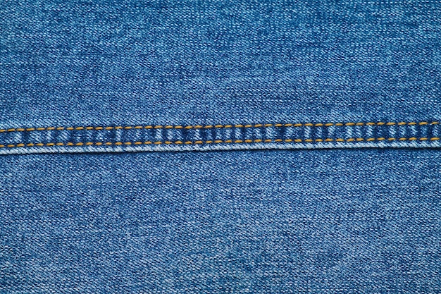 Nahaufnahme der Blue Jeans-Textur mit gerader Naht Denim-Textilhintergrund Stoff für Kleidung