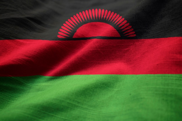 Foto nahaufnahme der gekräuselten malawi-flagge, malawi-flagge, die im wind durchbrennt