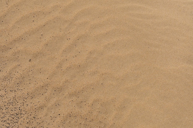 Foto nahaufnahme des sandmusters eines strandes oder einer wüste