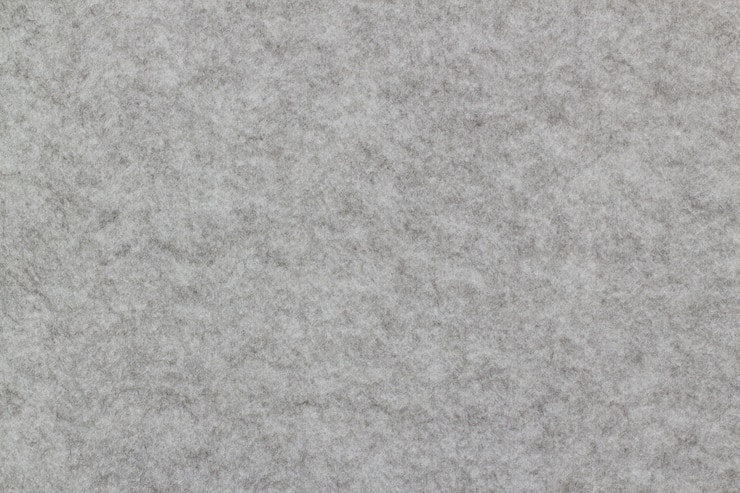 Foto nahaufnahme des schallschutzbrettes, graue wand, zum der geräusche zu verringern gemacht von glasswool