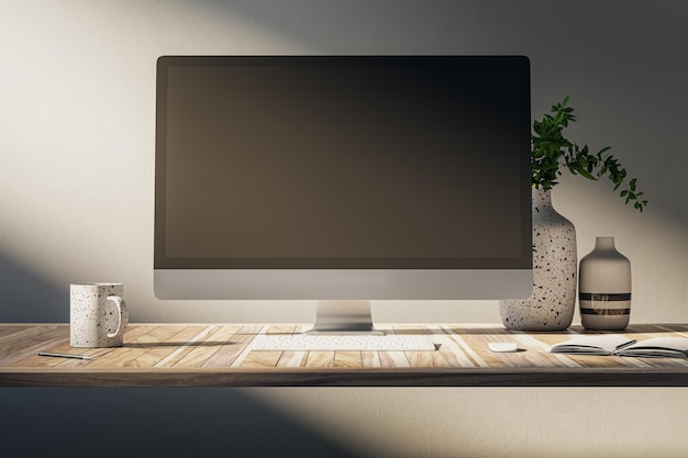 Nahaufnahme eines kreativen Desktop-Designers mit leerem Computerbildschirm, Kaffeetasse und anderen Gegenständen auf Betonwand-Hintergrund Arbeitsraumkonzept Mock-up 3D-Rendering