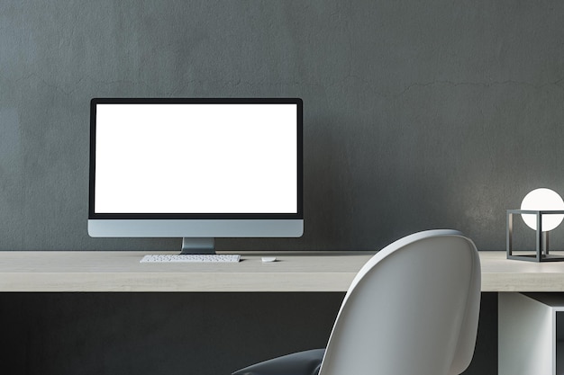 Nahaufnahme eines zeitgenössischen weißen Computerbildschirms am Arbeitsplatz eines modernen Designerbüros im Innenraum Betonwandhintergrund 3D-Rendering