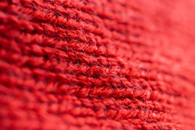 Nahaufnahme rot gestrickter Wollstoff Textur Hintergrund