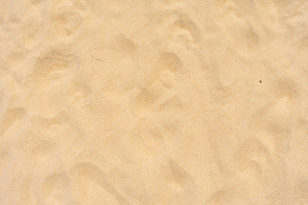 Nahaufnahme sandbeschaffenheit am strand in der sommersonne als hintergrund