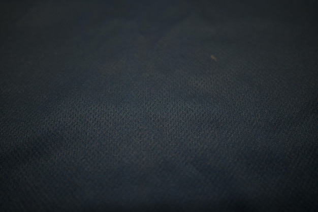Nahaufnahme Schwarzer Fußballtrikot Kleidung Stoff Textur Sportbekleidung Hintergrund Stoff für Sportbekleidung