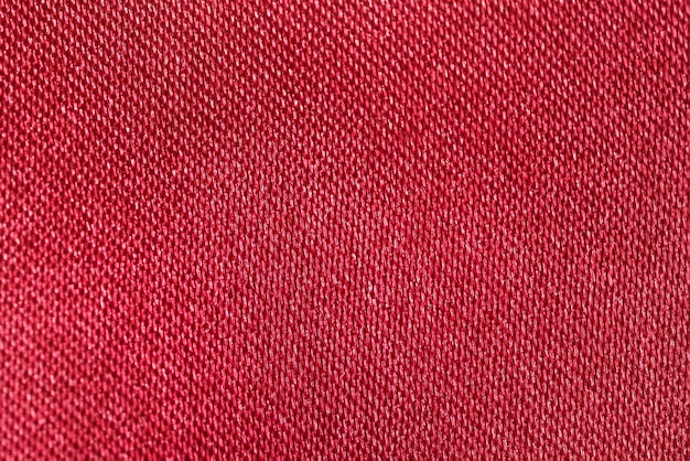 Foto nahaufnahme textur aus polyesterstoff in roter farbe mit glanz hintergrund für ihr design nähmaterial