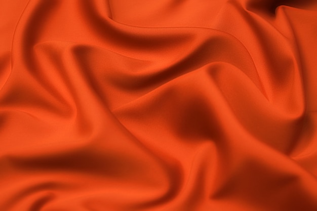 Nahaufnahme Textur des natürlichen roten oder orange Stoffes oder Stoffes in der gleichen Farbe.
