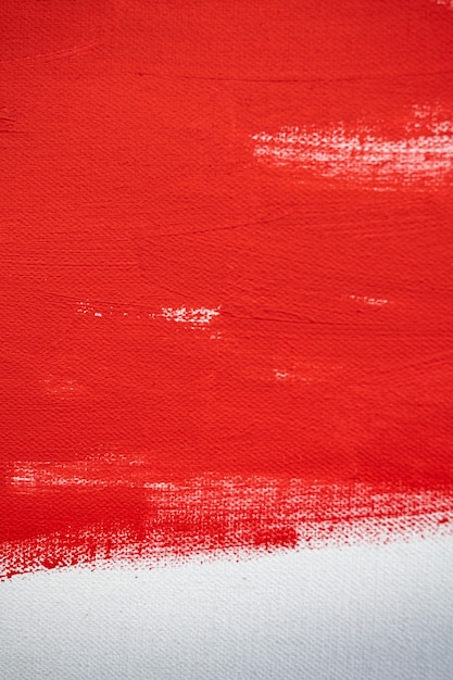 Nahaufnahme Textur Rote Farbe auf weißer Leinwand Pinselstriche für Papiergrafikdesign im Hintergrund