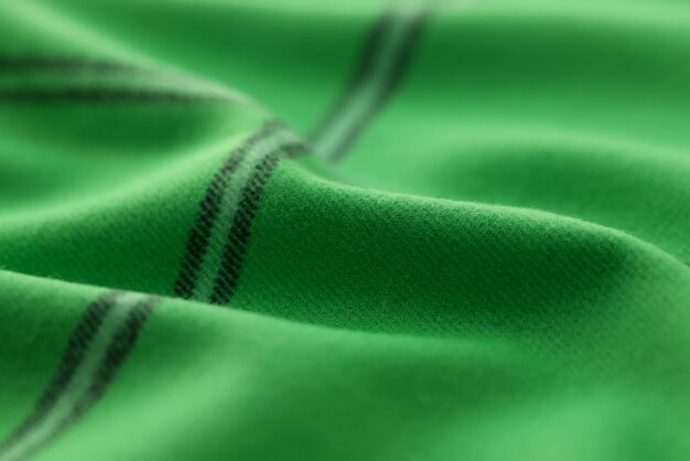 Foto nahaufnahme von grünem wollstoff textilstoff textur hintergrund natürliche baumwollseide oder wolle oder