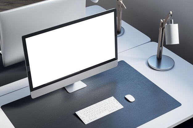 Nahaufsicht und Überblick über den Desktop eines Designer-Büros mit einem Computerbildschirm auf einem weißen Schreibtisch, einer Teppichlampe und anderen Gegenständen Mock-up 3D-Rendering