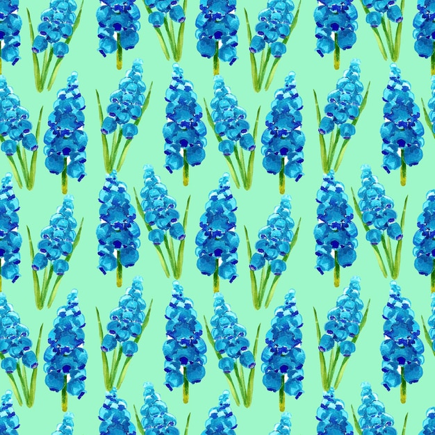 Nahtloses Muster aus blauen Hyazinthenblumen auf grünem Hintergrund. Aquarell. Nahtloses Muster aus blauen Hyazinthenblumen auf grünem Hintergrund. aquarellvorratillustration