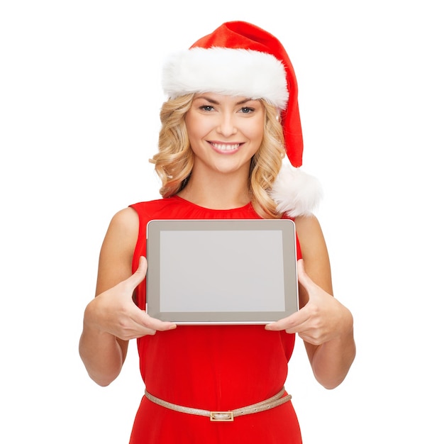 natal, natal, eletrônicos, conceito de gadget - mulher sorridente com chapéu de ajudante de Papai Noel com tela em branco do tablet pc