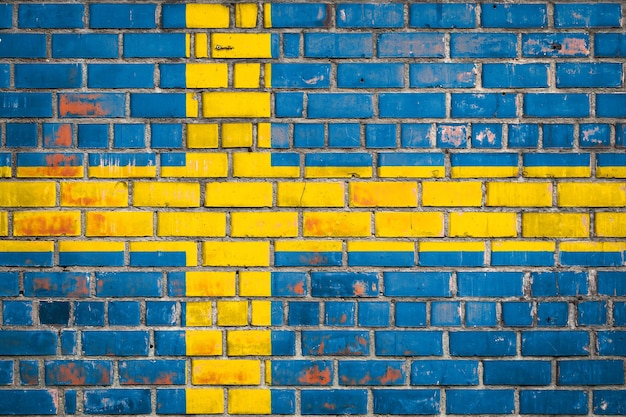 Nationalflagge Schwedens auf einem Grunge-Backstein-Hintergrund