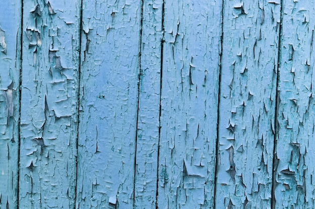 Natürlicher abstrakter Hintergrund der strukturierten rissigen Holzwand der blauen Farbe.