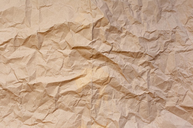 Natürlicher abstrakter strukturierter Hintergrund aus zerknittertem beige Papier