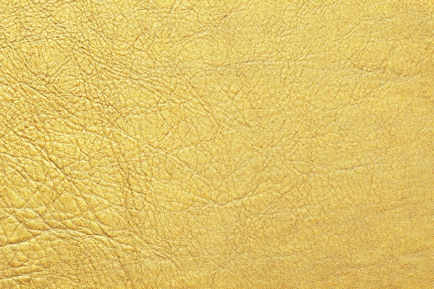 Natürlicher Hintergrund der goldenen Lederbeschaffenheit für Design